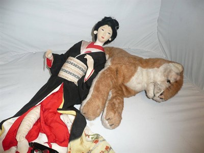 Lot 56 - A Merrythought tiger, a Japanese Fashou doll, baby bonnets, lace etc