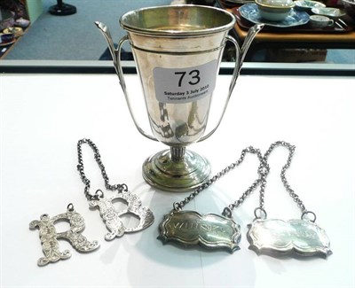 Lot 73 - Silver bottle labels and a silver trophy vase