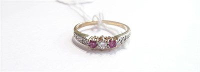 Lot 87 - A ring set with red and clear stones, 9ct
