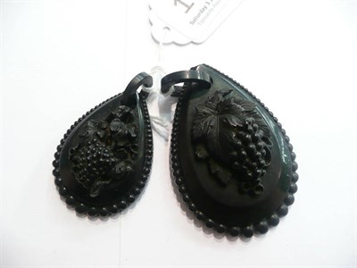 Lot 106 - Two carved jet pendants