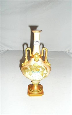 Lot 126 - A Royal Worcester blush ivory two handled pedestal vase.
