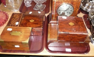 Lot 142 - An amboyna mantel clock, six various mahogany and amboyna caskets.