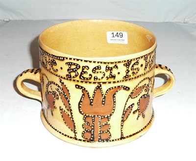Lot 149 - A twin-handled slip ware loving cup