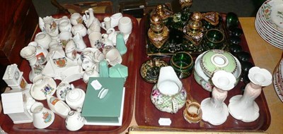 Lot 153 - Two trays of decorative ceramics and glass including a green glass dressing table set,...