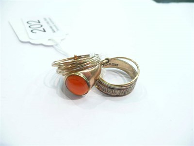 Lot 202 - A cornelian set signet ring, a 9ct gold patterned band and two other rings