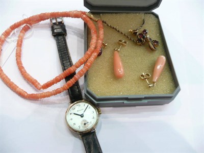 Lot 218 - A garnet cross, a pair of earrings, a lady's Accurist watch, coral necklace and a pair of earrings