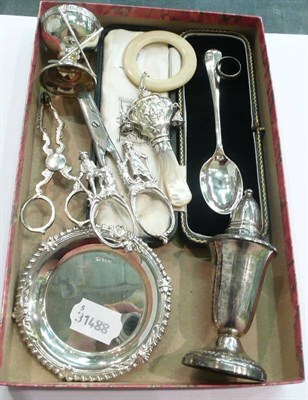 Lot 220 - Silver babies rattle with teething ring, cased silver teaspoon, a Sterling silver pepperette, a...