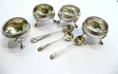 Lot 225 - Set of four silver circular salts and spoons