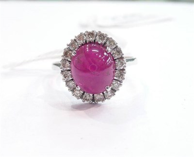 Lot 228 - A 14ct white gold ruby and diamond cluster ring