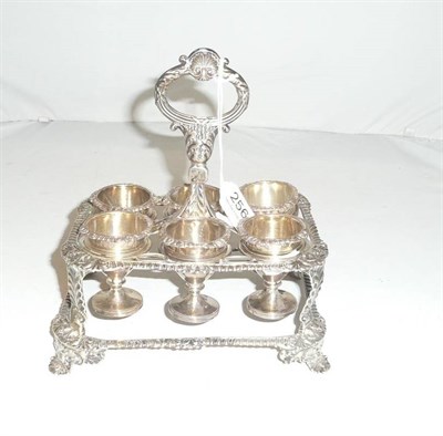 Lot 256 - A Victorian silver egg cruet stand, London 1824, Rebecca Eames and Edward Barnard, and six egg cups