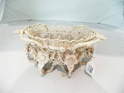 Lot 258 - A Belleek four strand basket, slight damages and restoration