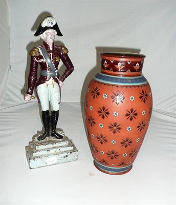 Lot 265 - A Mettlach vase and a painted cast iron door stop