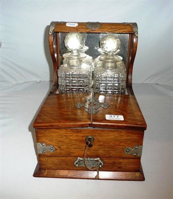 Lot 277 - Victorian two bottle oak tantalus