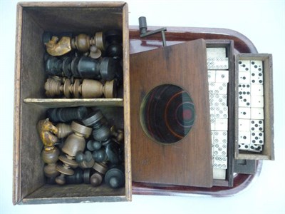 Lot 304 - Chess pieces, two boxes of dominoes and a mechanical kaleidoscope lantern slide