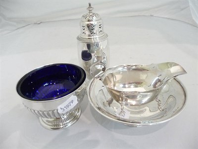 Lot 371 - A silver caster, Birmingham 1936, a silver sauce boat, Birmingham 1947, a silver pedestal dish,...