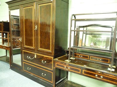 Lot 429 - An Edwardian dark stained mahogany and cross-banded seven piece bedroom suite by Maples