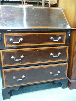 Lot 442 - An Edwardian cross-banded and dark stained mahogany small bureau