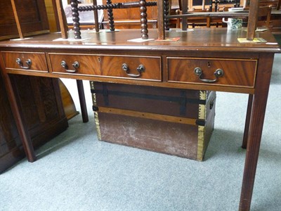 Lot 451 - A Georgian style mahogany desk with three frieze drawers