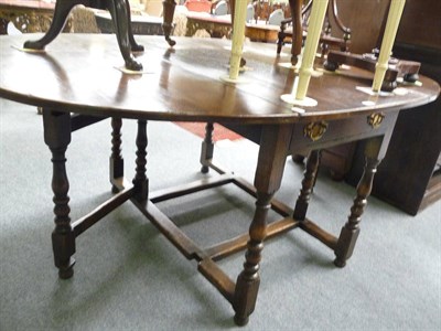 Lot 460 - Reproduction oak gateleg table with two frieze drawers