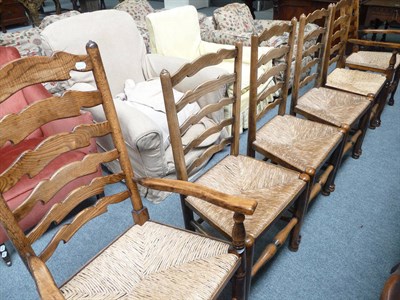 Lot 486 - Six ash ladder-back chairs with rush seats