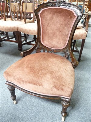 Lot 491 - A Victorian walnut nursing chair