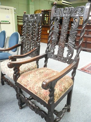 Lot 506 - Two Carolean style oak armchairs