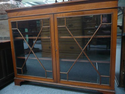 Lot 519 - Edwardian box-strung mahogany glazed bookcase