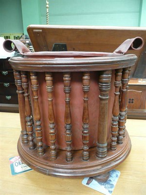 Lot 524 - A late Victorian turned mahogany jardiniere and liner, retailed by Druce & Co