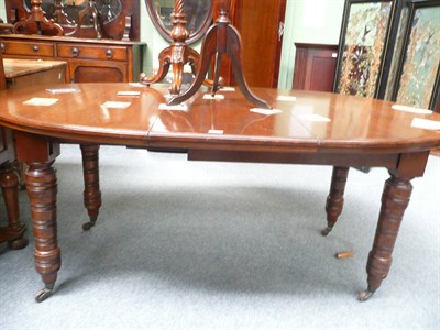 Lot 536 - Victorian walnut wind-out dining table with leaf and winder