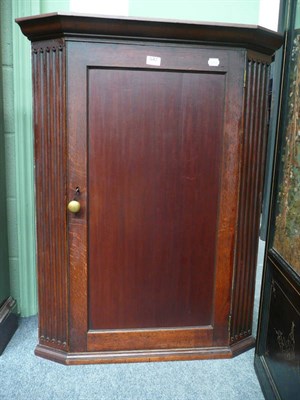 Lot 547 - Oak corner cupboard