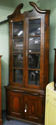 Lot 555 - 18th century and later Continental inlaid walnut corner cupboard