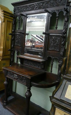 Lot 558 - Carved oak hall stand