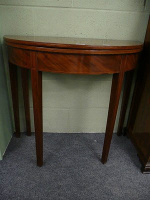 Lot 573 - 19th century mahogany demi-lune fold-over tea table