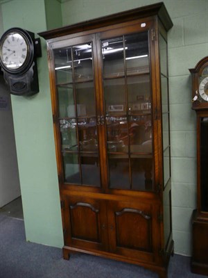 Lot 578 - A Titchmarsh & Goodwin style oak display cabinet