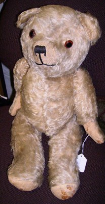 Lot 1001 - Yellow Plush Jointed Teddy Bear with glass eyes, stitched nose and mouth, felt paw pads, 49cms.