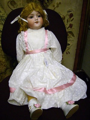 Lot 1013 - Armand Marseille 390 Bisque Socket Head Doll with replacement wig, fixed blue eyes, open mouth,...