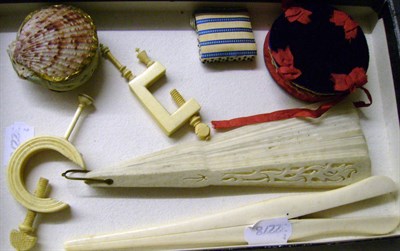 Lot 1050 - Two Ivory Sewing Clamps, a shell pin cushion, a silk and velvet pin cushion/needle case,...