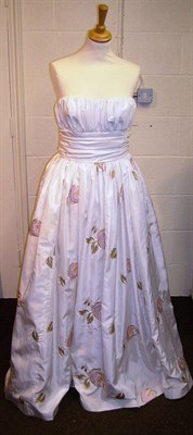 Lot 1054 - Frank Usher Strapless Full Length White Evening Dress decorated with pink flowers and matching wrap