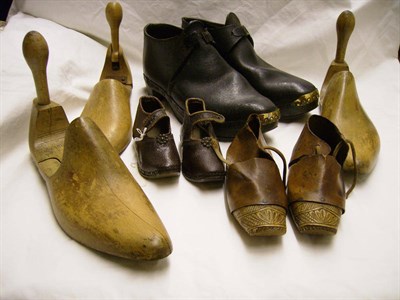 Lot 1071 - Pair of Childs' 19th Century Carved Wood Clogs With Leather Mounts, 16 cms long; small pair of...