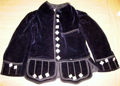 Lot 1073 - Early 20th Century Childs Black Velvet Jacket with one braided epaulette, braid appliques and...