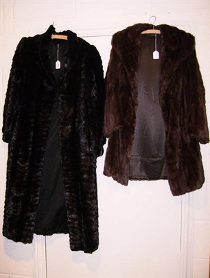 Lot 1087 - A Black Full Length Fur Coat, brown fur coat with shawl neck collar, sable stole, an ermine...