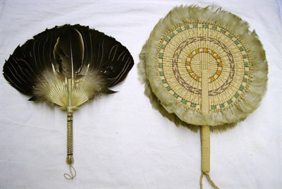 Lot 1092 - Seven Asian Fans including a sandalwood cockade fan; three coloured pressed paper fans; three...