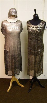 Lot 1109 - Two Circa 1920's Silver Lame Shift Dresses And A Sequin And Silver Lame Cloche Style Hat (3)