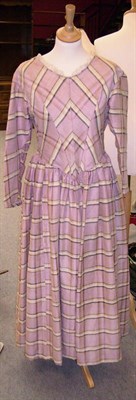 Lot 1122 - An Early Victorian Pink Check Glazed Wool Dress, circa 1840, with fitted panelled bodice and...