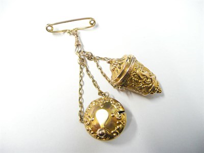 Lot 1143 - A Chatelaine, with 9 carat gold thimble case and tape measure, both decorated with scroll work, and