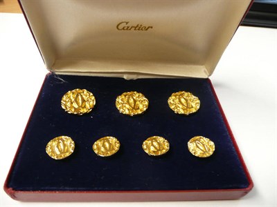 Lot 1147 - A Cased Set of Buttons, signed Cartier, three large and four smaller, each with a double C...