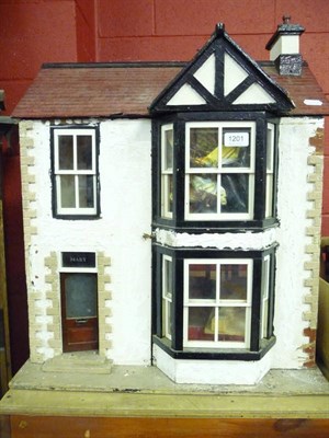 Lot 1201 - A dolls house with furniture