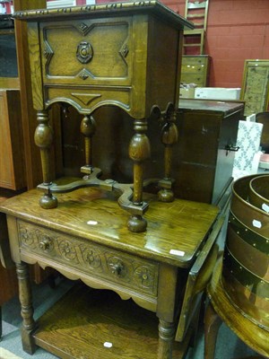 Lot 1218 - An oak coffee table, an oak sewing table, and an oak hostess trolley