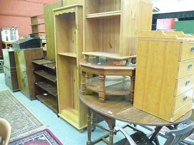 Lot 1221 - A mahogany open bookcase; two pine open bookcases; a glass top coffee table; a folding slatted...