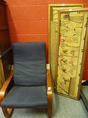 Lot 1235 - A modern easy chair and two oak-framed Egyptian style tapestry panels